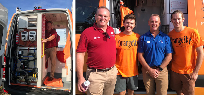 Richard Jay and Orange Sky staff in front of Orange Sky Laundry Van